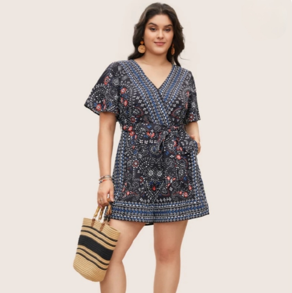 BloomChic Navy Blue Floral Wrap Romper with Pink Accents